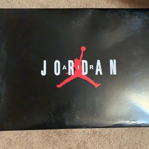 Black cement Jordan 11 IE